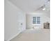Spacious bonus room provides a ceiling fan, carpet and natural lighting at 5328 Willow Cry Ln, Raleigh, NC 27613