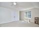 Bonus room offers ample natural lighting, carpet, and a ceiling fan at 5328 Willow Cry Ln, Raleigh, NC 27613