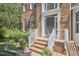 Close-up of the front entrance showing brick steps, white railings, and the address displayed above the door at 5328 Willow Cry Ln, Raleigh, NC 27613