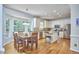 Sunlit kitchen with a breakfast nook, stainless steel appliances, and a center island at 5328 Willow Cry Ln, Raleigh, NC 27613
