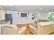 Living room with hardwood floors, recessed lighting, and a small kitchenette at 5328 Willow Cry Ln, Raleigh, NC 27613
