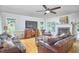 Cozy living room with hardwood floors, a brick fireplace, and comfortable seating at 5328 Willow Cry Ln, Raleigh, NC 27613
