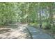 A picturesque path winding through a tranquil wooded area at 5328 Willow Cry Ln, Raleigh, NC 27613