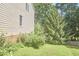 Side yard featuring garden and exterior of home with brick foundation at 5328 Willow Cry Ln, Raleigh, NC 27613