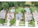 Aerial view of a neighborhood showcasing well-manicured lawns and in-ground pools at 5629 Clearsprings Dr, Wake Forest, NC 27587