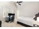 Comfortable bedroom with large window, neutral color palette, and ceiling fan at 5629 Clearsprings Dr, Wake Forest, NC 27587