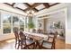 Dining room with coffered ceilings, hardwood floors, and wainscoting at 5629 Clearsprings Dr, Wake Forest, NC 27587