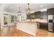 Gourmet kitchen featuring stainless appliances and a kitchen island with granite countertops at 5629 Clearsprings Dr, Wake Forest, NC 27587