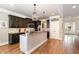 Gourmet kitchen island features granite countertops and stainless steel appliances at 5629 Clearsprings Dr, Wake Forest, NC 27587
