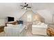 Cozy upstairs living room with vaulted ceiling and comfortable seating, perfect for relaxation and entertainment at 5629 Clearsprings Dr, Wake Forest, NC 27587