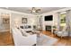 Cozy living room with hardwood floors, a fireplace, and plenty of natural light at 5629 Clearsprings Dr, Wake Forest, NC 27587