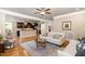 This open-concept living room features hardwood floors and is adjacent to kitchen at 5629 Clearsprings Dr, Wake Forest, NC 27587