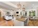 Open concept, showing kitchen island overlooking the living room with fireplace at 5629 Clearsprings Dr, Wake Forest, NC 27587