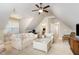 Spacious upstairs living room features a comfortable sofa and chairs with ample natural light and a small desk area at 5629 Clearsprings Dr, Wake Forest, NC 27587