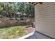 Well-maintained backyard featuring a stone retaining wall and lush greenery at 5824 Cameo Glass Way, Raleigh, NC 27612