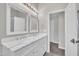 Bright bathroom featuring a double sink vanity with marble countertop, stylish lighting, and modern mirrors at 5824 Cameo Glass Way, Raleigh, NC 27612