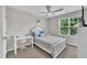 Bedroom with carpet floor, ceiling fan, bright window, and white decor at 5824 Cameo Glass Way, Raleigh, NC 27612
