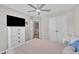 Bedroom with carpet floor, ceiling fan, chest of drawers and neutral walls at 5824 Cameo Glass Way, Raleigh, NC 27612