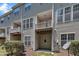View of a multi-level townhome with a patio and balconies on each level at 5824 Cameo Glass Way, Raleigh, NC 27612