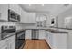 Well-equipped kitchen with stainless steel appliances and white subway tile backsplash at 5824 Cameo Glass Way, Raleigh, NC 27612