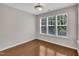 Sunlit room with hardwood floors and large windows at 5824 Cameo Glass Way, Raleigh, NC 27612