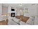 Cozy living room showcasing a fireplace, hardwood floors, neutral walls, and comfortable seating at 5824 Cameo Glass Way, Raleigh, NC 27612