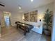 Inviting game room with shuffleboard table, comfortable seating, and stylish decor at 5900 Dunzo Dr, Raleigh, NC 27617