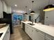 Bright kitchen with a large center island, stainless steel appliances, and adjacent dining area at 5902 Dunzo Dr, Raleigh, NC 27617