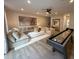 Spacious living room with hardwood floors, neutral furnishings, and a unique shuffleboard table at 5902 Dunzo Dr, Raleigh, NC 27617