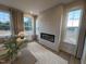 Living room featuring lots of windows and modern fireplace at 5902 Dunzo Dr, Raleigh, NC 27617