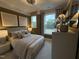 Comfortable bedroom featuring a plush bed, neutral colors, and large windows for abundant natural light at 5904 Dunzo Dr, Raleigh, NC 27617