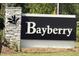 Elegant stone sign for the Bayberry community surrounded by lush landscaping at 5904 Dunzo Dr, Raleigh, NC 27617