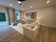 Bright living room with comfortable seating, large windows, and a view of the outdoors at 5904 Dunzo Dr, Raleigh, NC 27617