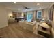 Spacious living room featuring comfortable seating, a game table, a ceiling fan, and sliding glass doors at 5904 Dunzo Dr, Raleigh, NC 27617