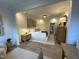 Open-concept main bedroom suite boasts neutral decor, bright lighting, and seamless flow throughout the space at 5904 Dunzo Dr, Raleigh, NC 27617