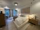 Bright main bedroom suite with neutral colors, stylish wall accents, and large windows for ample natural light at 5904 Dunzo Dr, Raleigh, NC 27617