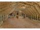 View of an unfinished attic featuring exposed rafters and plywood flooring ready for custom build-out at 6332 Mountain Oaks Way, Wake Forest, NC 27587