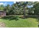 A well-maintained yard with lush grass and mature trees at 6332 Mountain Oaks Way, Wake Forest, NC 27587