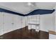 Well-lit bedroom featuring built-in shelves and a desk area, with hardwood floors at 6332 Mountain Oaks Way, Wake Forest, NC 27587