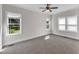Sunlit bedroom with neutral carpet and multiple windows at 6332 Mountain Oaks Way, Wake Forest, NC 27587