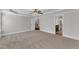 Large bedroom with soft carpet, tray ceiling, and access to an en-suite bathroom at 6332 Mountain Oaks Way, Wake Forest, NC 27587
