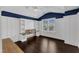 Bright bedroom featuring a built-in bench, a ceiling fan and hardwood floors at 6332 Mountain Oaks Way, Wake Forest, NC 27587