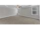 Expansive bedroom with plush carpeting, ceiling fan, and ample natural light at 6332 Mountain Oaks Way, Wake Forest, NC 27587
