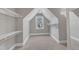 A carpeted walk-in closet features a window and shelving at 6332 Mountain Oaks Way, Wake Forest, NC 27587
