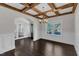 Dining room featuring dark wood flooring, decorative ceiling beams and wainscoting at 6332 Mountain Oaks Way, Wake Forest, NC 27587