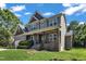 Beautiful two-story home with a covered porch, stone accents, and well-kept lawn at 6332 Mountain Oaks Way, Wake Forest, NC 27587