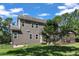View of the home exterior featuring gray siding and a screened-in porch at 6332 Mountain Oaks Way, Wake Forest, NC 27587