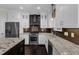 Modern kitchen with white cabinets, stainless steel appliances, and granite countertops at 6332 Mountain Oaks Way, Wake Forest, NC 27587