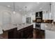 Lovely kitchen with white cabinets, a dark wood island, and stainless steel appliances at 6332 Mountain Oaks Way, Wake Forest, NC 27587