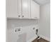 Functional laundry room featuring white cabinets and essential hookups at 6332 Mountain Oaks Way, Wake Forest, NC 27587